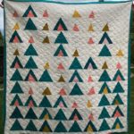 quilt featuring triangle shapes to resemble mountains