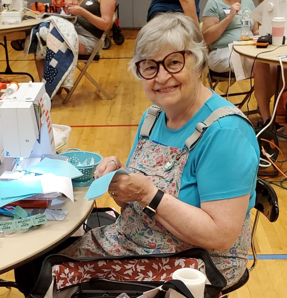 smiling woman sewing